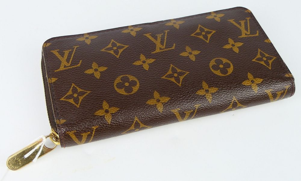 Appraisal: LOUIS VUITTON LADIES MONOGRAMED WALLET Measures long and wide from