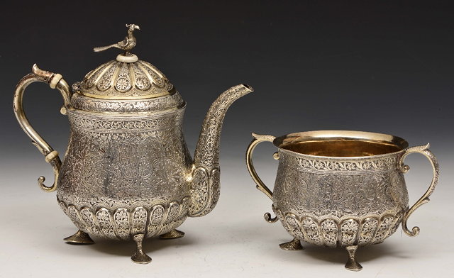 Appraisal: AN INDIAN SILVER TEA POT and bowl of baluster form