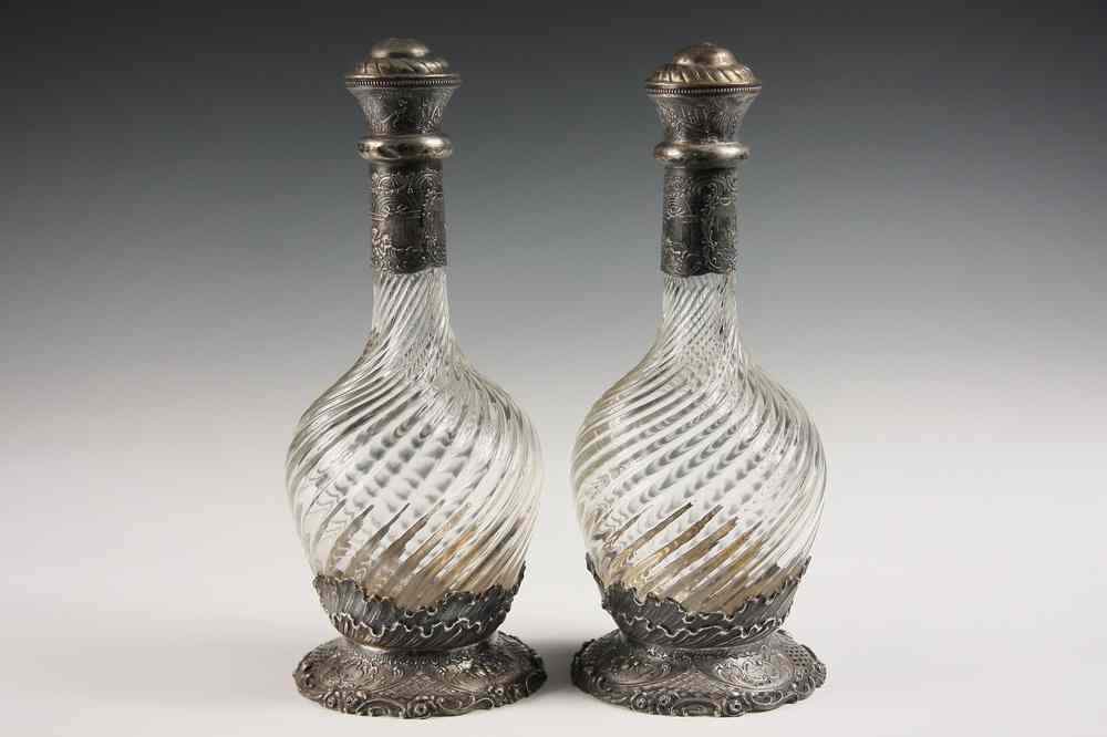 Appraisal: PAIR DUTCH SILVER CRYSTAL DECANTERS - Two Swirl Cut Crystal