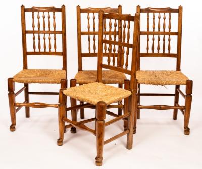 Appraisal: Four ash spindle back chairs with rush seats on turned