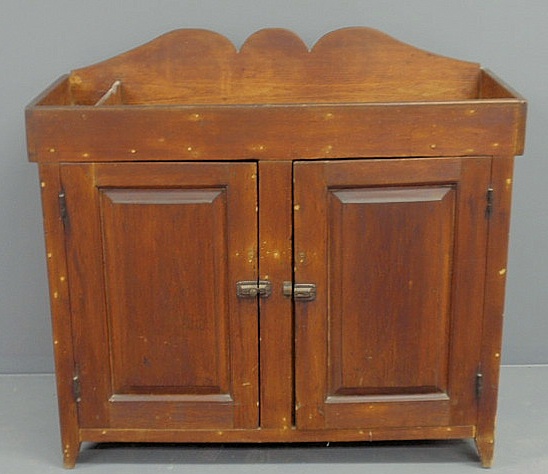 Appraisal: Pennsylvania pine dry sink c with a carved backsplash and