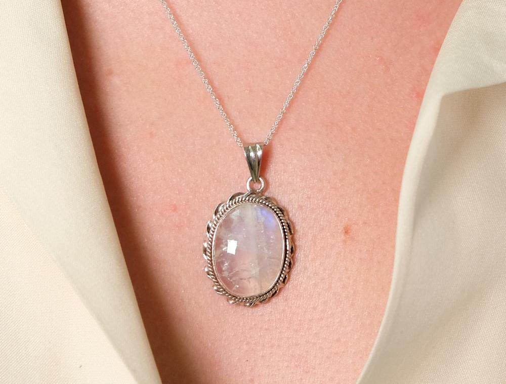 Appraisal: Sterling silver necklace hung with a oval blue flash Moonstone