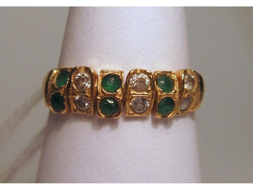 Appraisal: Fourteen carat gold emerald and white sapphire half hoop ring