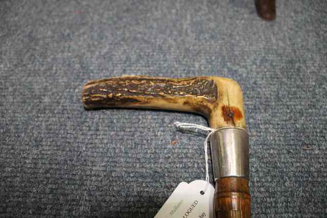 Appraisal: A LATE VICTORIAN WALKING STICK with antler handle and drawing