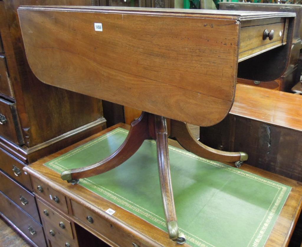 Appraisal: A th century mahogany Pembroke breakfast table fitted with two