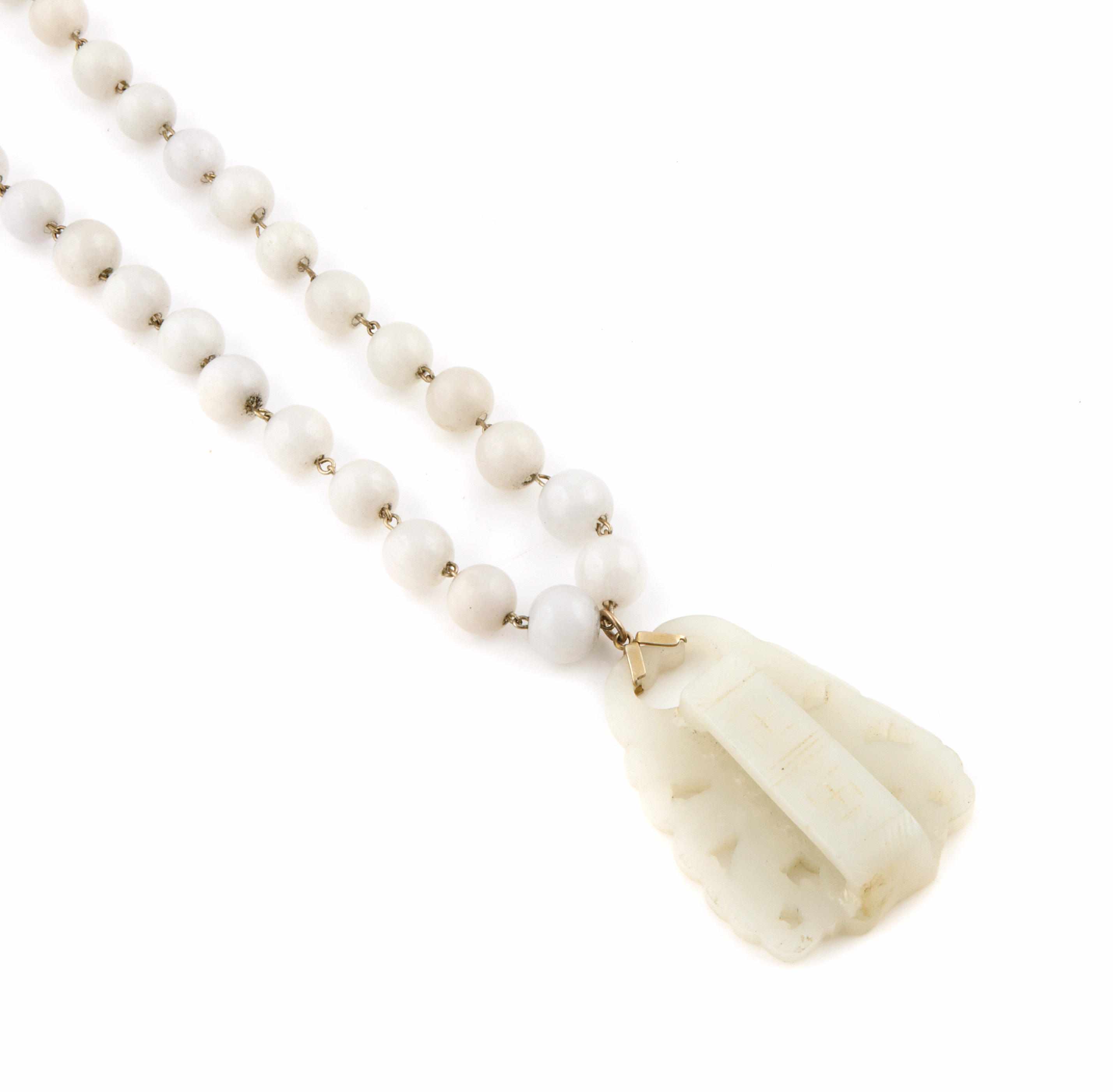 Appraisal: A white jade bead and metal pendant-necklace