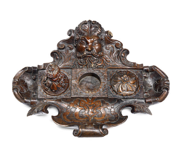 Appraisal: An Italian th century carved walnut encrier surmounted by a