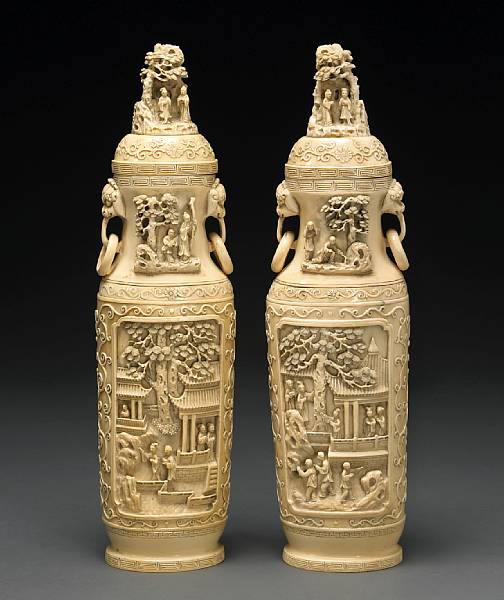 Appraisal: A pair of pieced ivory covered vases th Century Each