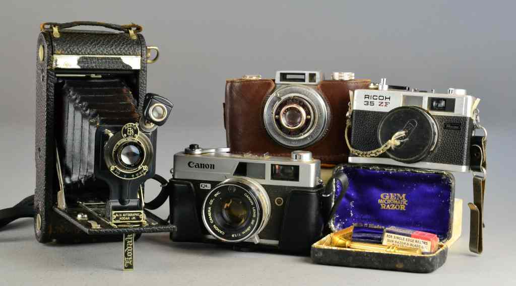 Appraisal: Lot of Vintage Cameras with One ShaverTo include one Ricoh