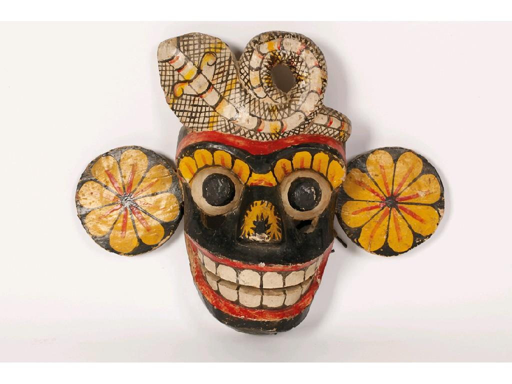 Appraisal: AN INDIAN FOLK ART PAINTED MASK of a smiling face