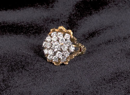 Appraisal: K white gold diamond cluster ring with encasement having nineteen