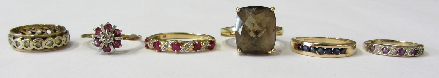 Appraisal: A ct gold ruby and diamond set half hoop ring