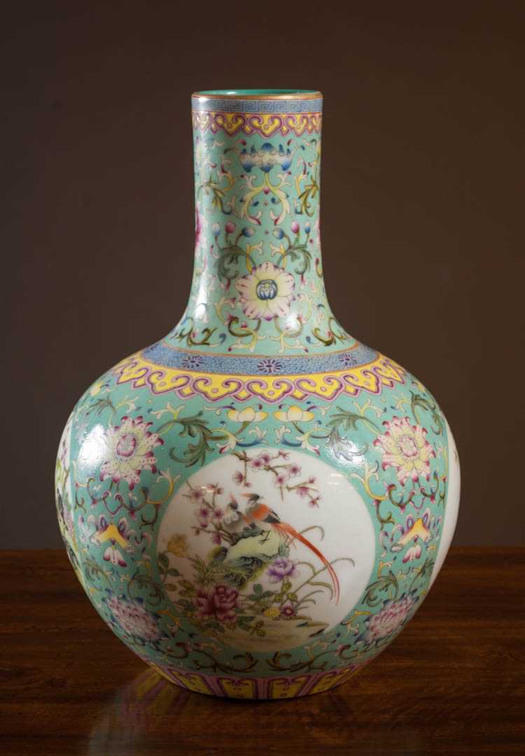 Appraisal: CHINESE QING PORCELAIN VASE featuring finely enameled cartouches of blooming