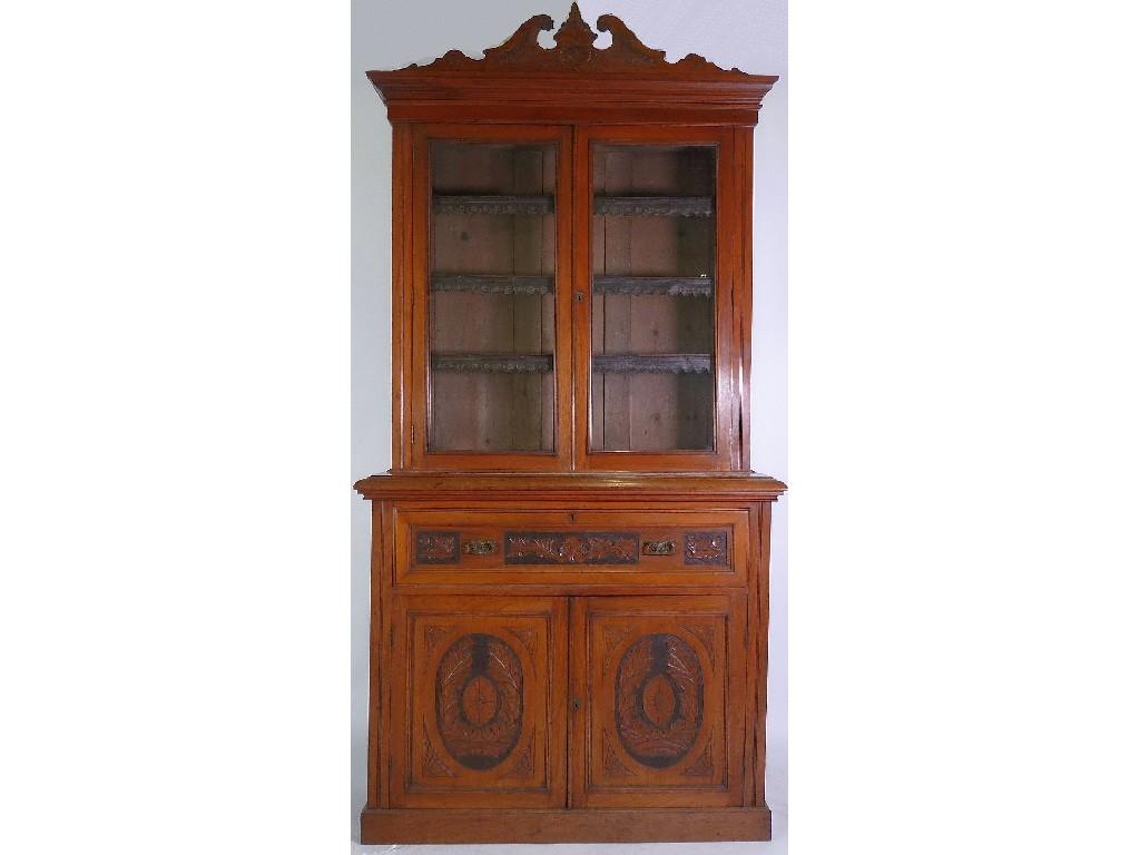 Appraisal: LATE VICTORIAN CARVED WALNUT SECRETAIRE BOOKCASE the floral carved broken