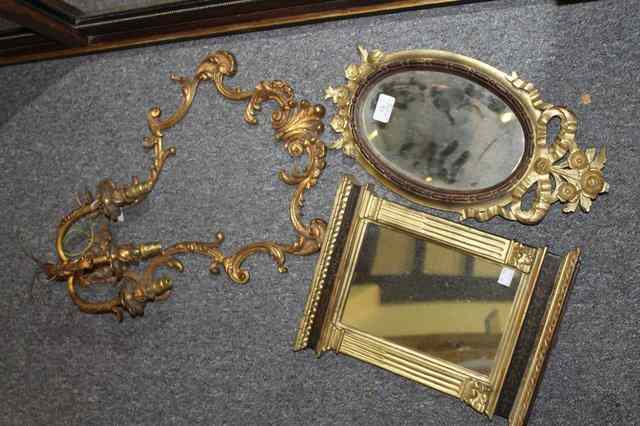 Appraisal: A CARVED OVAL SMALL WALL MIRROR with ribbon tie mount