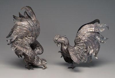 Appraisal: Two silver plate roosters cocks in fighting positions with spread