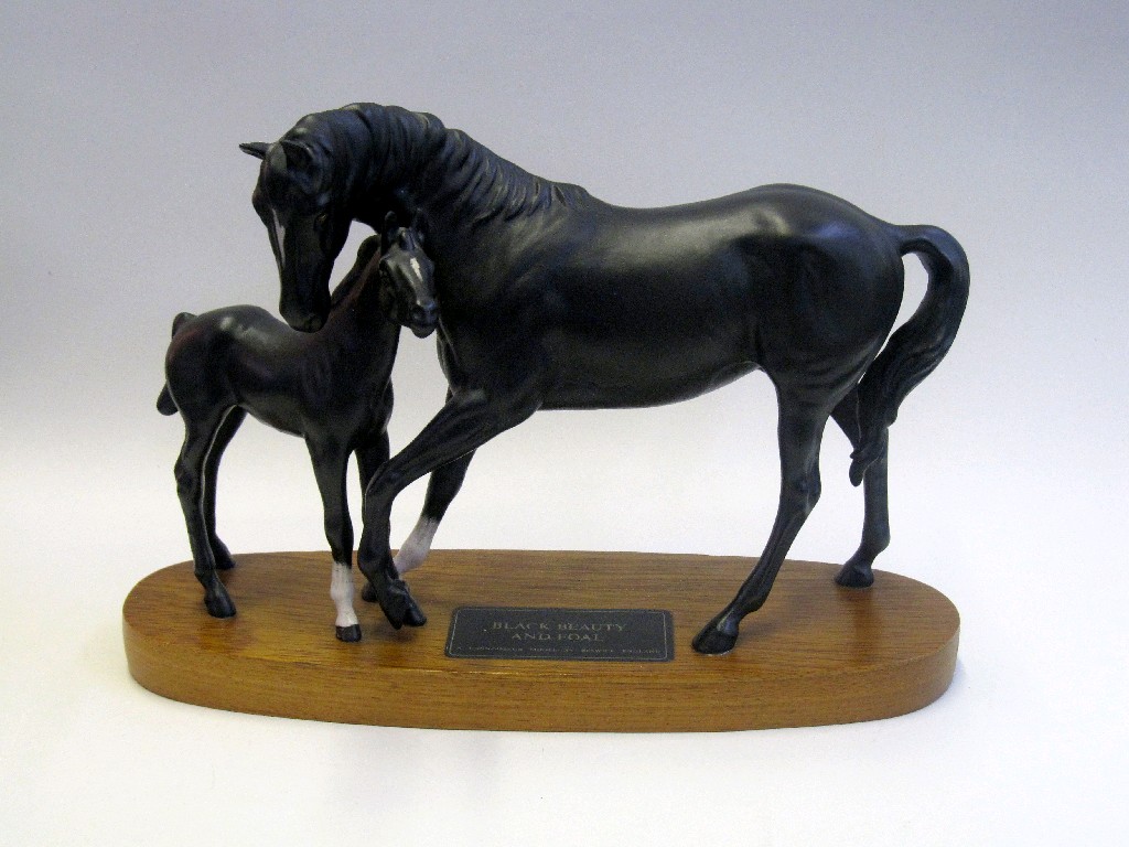 Appraisal: Beswick figure group 'Black Beauty and Foal' on wooden plinth