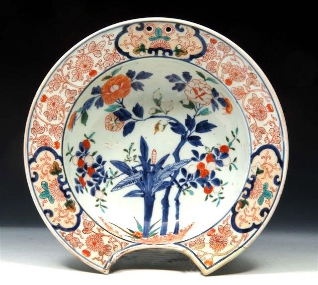 Appraisal: A JAPANESE IMARI BARBER'S BOWL th Century the centre decorated