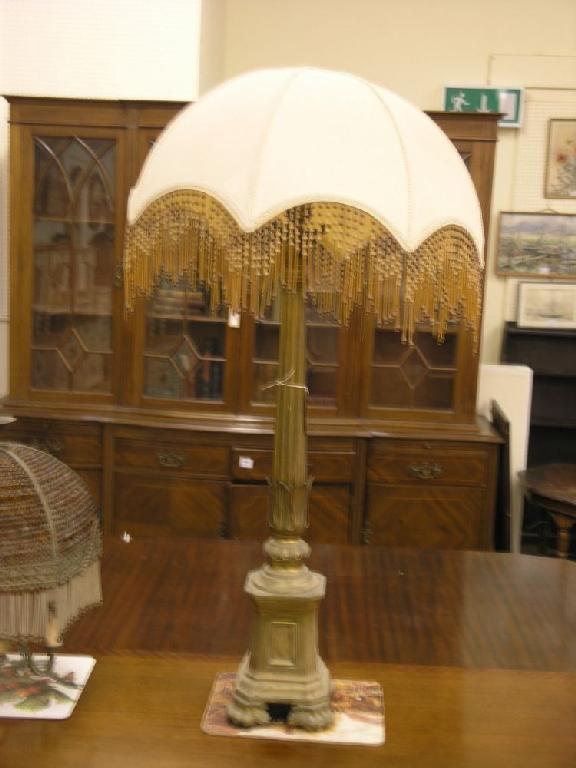 Appraisal: An architectural brass floor lamp with tapering fluted column and