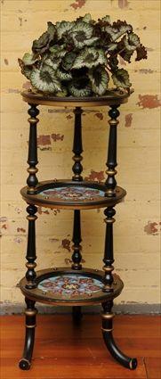 Appraisal: AESTHETIC MOVEMENT PARCEL-GILT TILE-INSET AND EBONIZED THREE-TIER STAND Each round