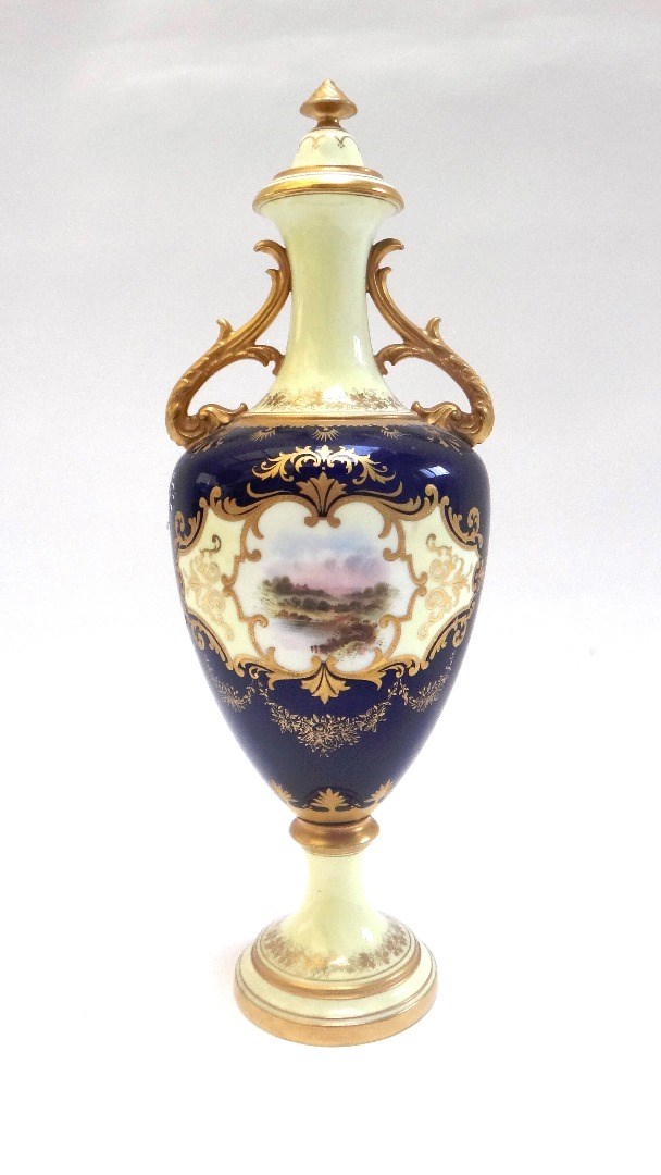 Appraisal: A Coalport porcelain two handled vase and cover circa painted