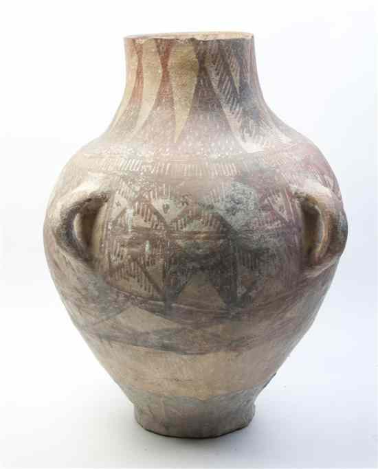 Appraisal: A Near Eastern Buff Pottery Amphora a handled body with