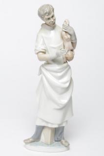 Appraisal: Lladro Porcelain Figurine Obstetrician w Baby Lladro retired porcelain figurine