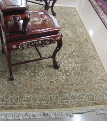 Appraisal: HAND KNOTTED ORIENTAL CARPET Pakistani-Persian central medallion and scrolling floral