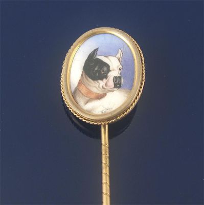 Appraisal: A gold stick pin mounted with an enamelled plaque depicting