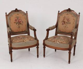 Appraisal: PAIR OF LOUIS XVI CARVED WALNUT FAUTEUILS PAIR OF LOUIS