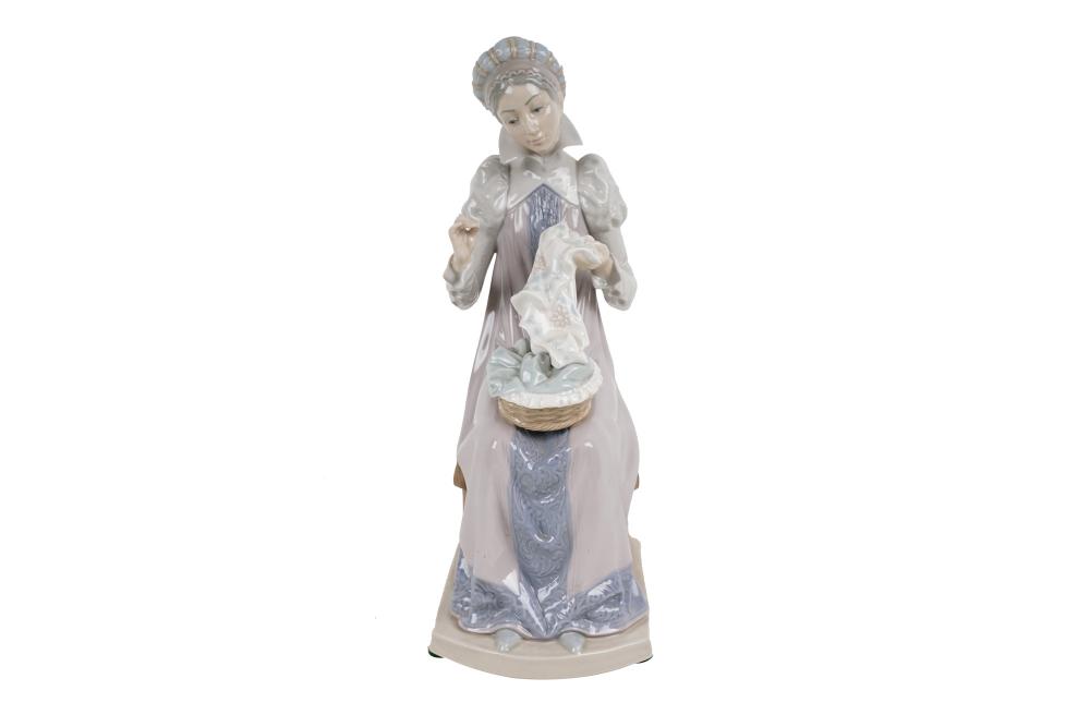 Appraisal: LLADRO PORCELAIN FIGURE WOMAN SEWINGmarked to underside Condition good inches