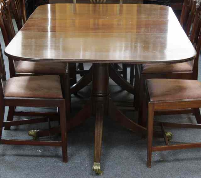 Appraisal: A Regency style twin-pedestal dining table the rounded ends each