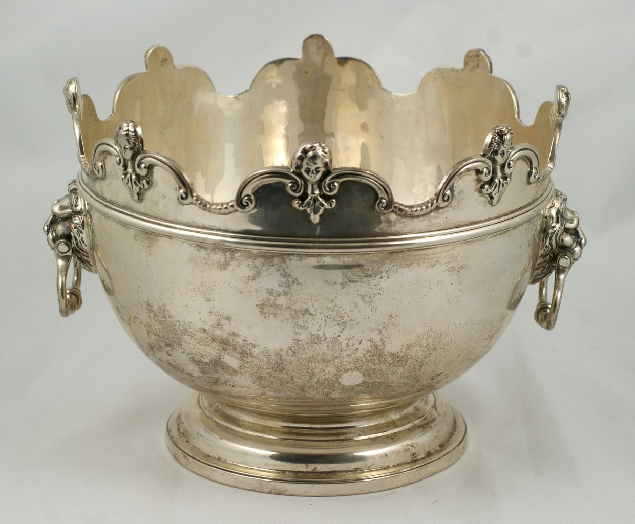 Appraisal: English sterling silver bowl scalloped top border with cherub head