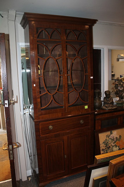 Appraisal: A TH CENTURY MAHOGANY BOOKCASE with fitted shelves enclosed by