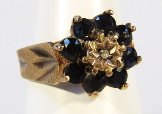 Appraisal: A dress ring florally set with blue stones on a