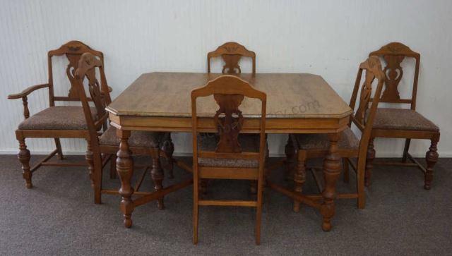 Appraisal: ca 's Walnut leg dining table with matching dining chairs