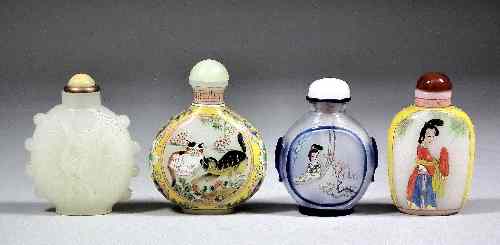 Appraisal: A Chinese white glass snuff bottle and stopper moulded with