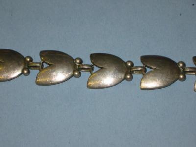 Appraisal: A GEORG JENSEN SILVER BRACELET the links modelled as stylised