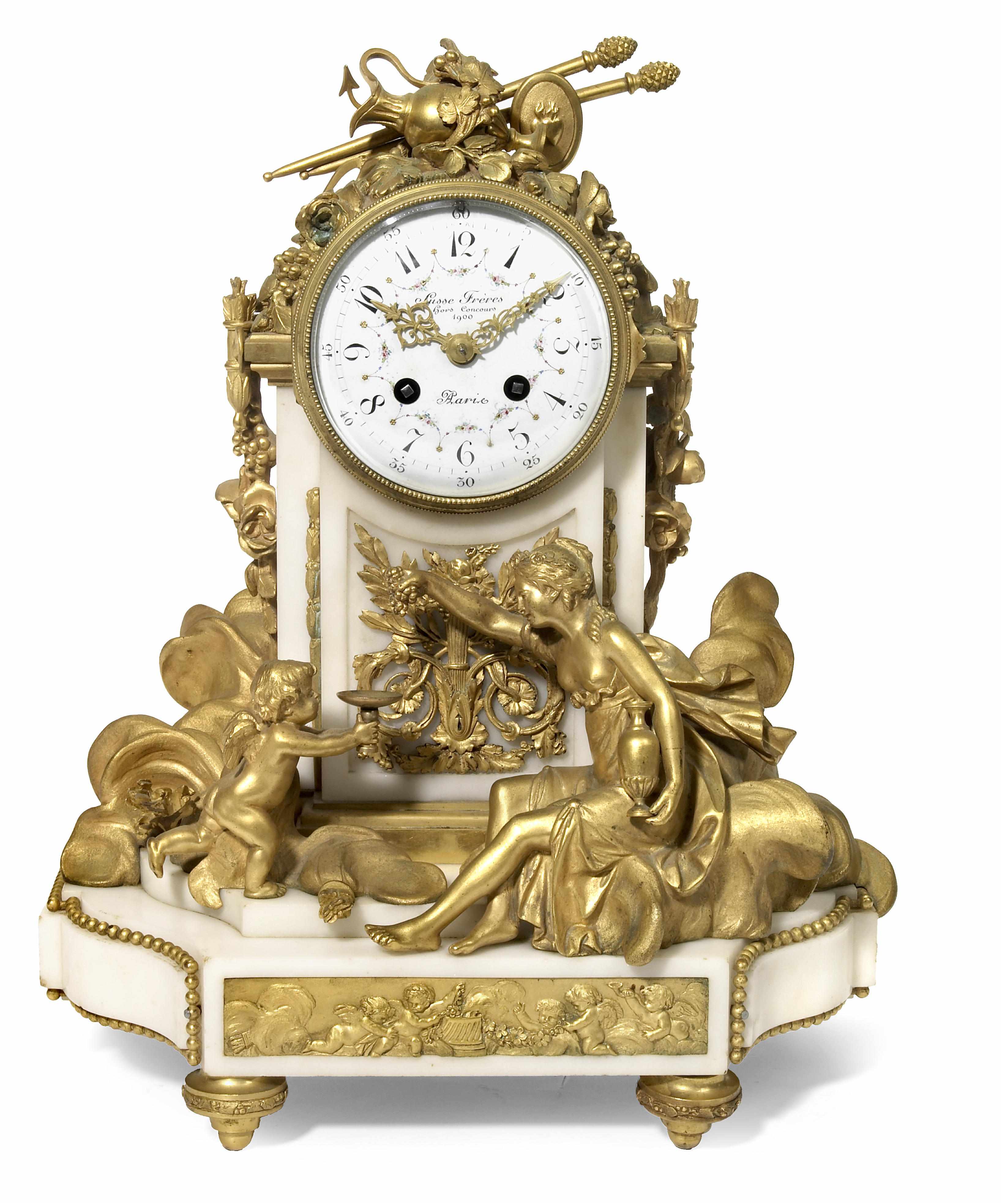 Appraisal: A Louis XVI style gilt bronze and marble mantel clock