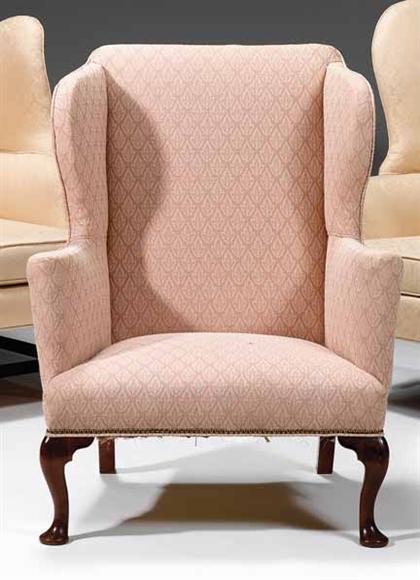 Appraisal: Queen Anne upholstered wing chair th century The straight crest