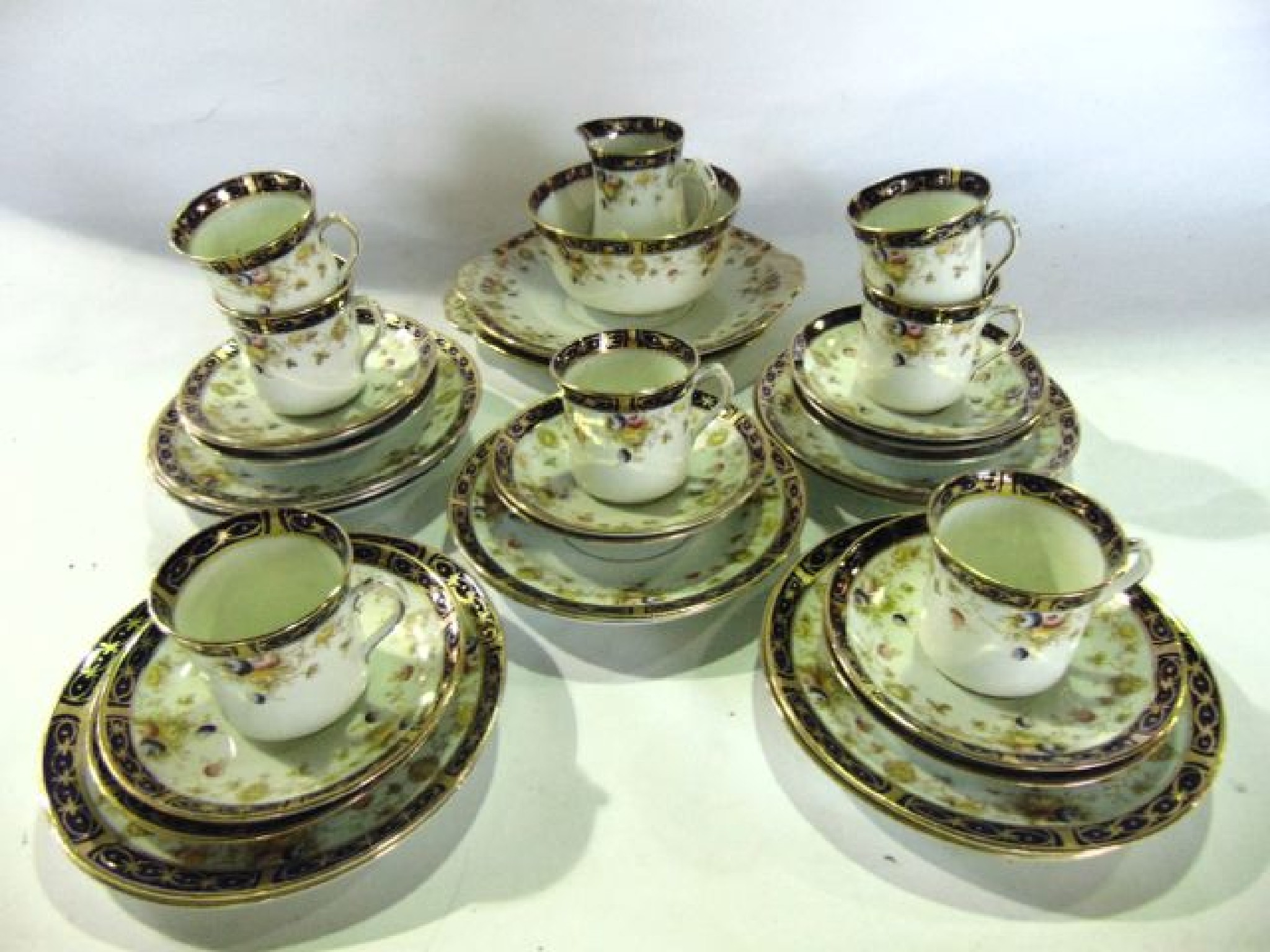 Appraisal: An incomplete Edwardian tea set The Elite with printed and