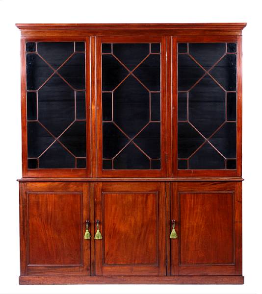 Appraisal: A late George III mahogany bookcase the upper case enclosed