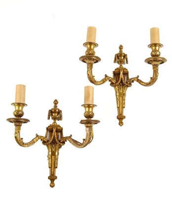 Appraisal: A pair of gilt brass two branch wall lights in