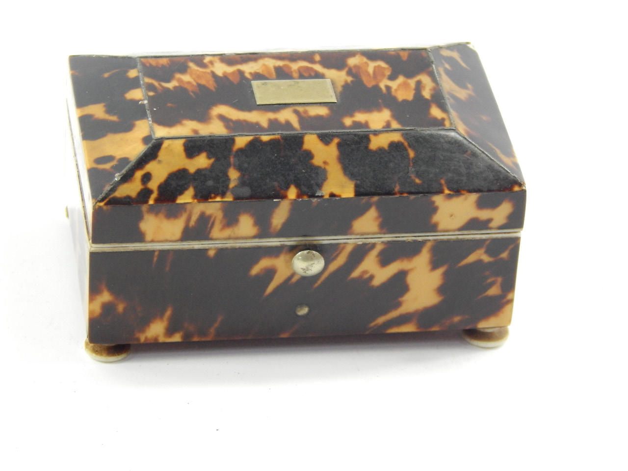 Appraisal: A thC tortoiseshell box of sarcophagus form mirror inset to