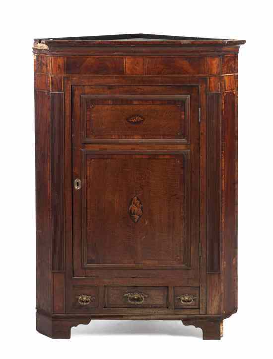 Appraisal: A Georgian Style Oak Corner Cabinet having a molded cornice