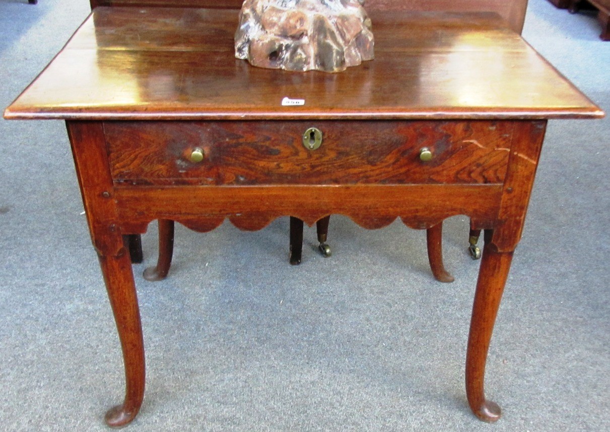 Appraisal: An th century elm side table with single frieze drawer