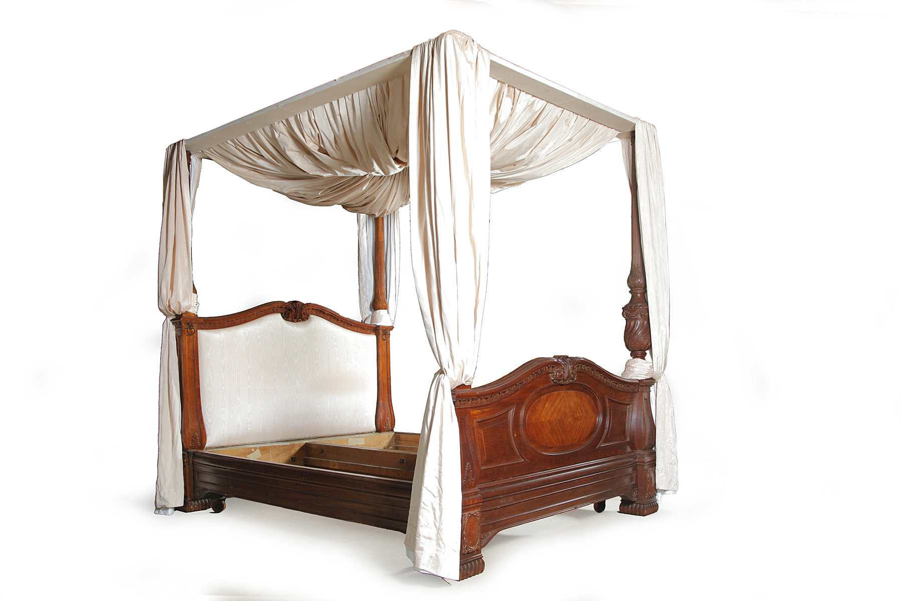 Appraisal: FRENCH ROCOCO-STYLE CANOPY BED Nineteenth century mahogany Elaborately turned and