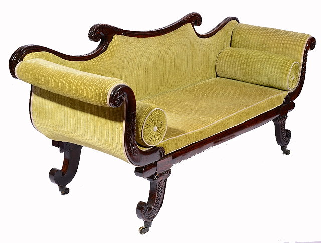 Appraisal: A REGENCY FAUX ROSEWOOD SCROLL END SETTEE with carved and