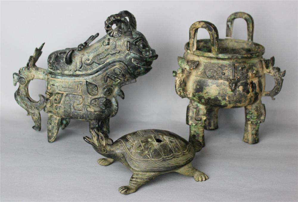 Appraisal: CHINESE BRONZE ARCHAISTIC POURING VESSEL in the Shang style together