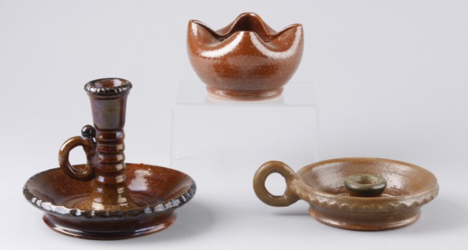 Appraisal: Lot of three Three redware candlesticks all with brown glaze